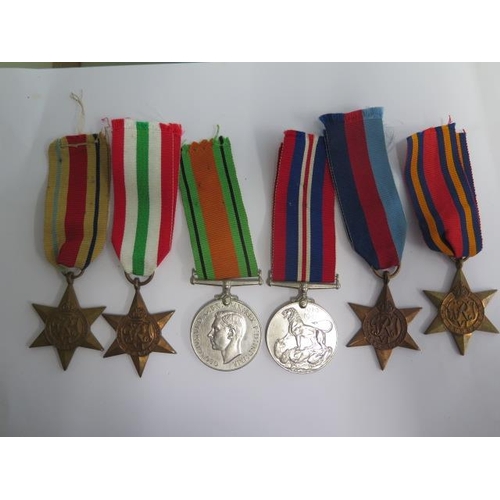 853 - A collection of six unnamed WWII medals