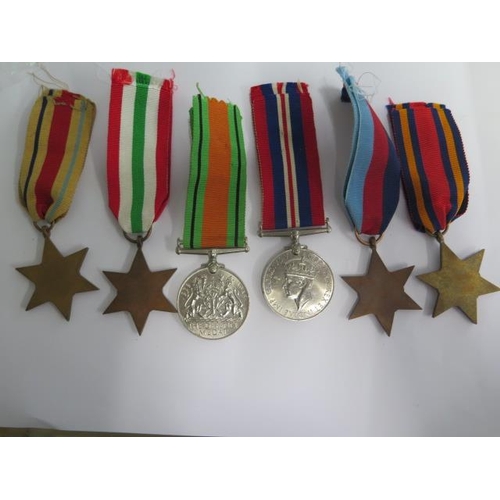 853 - A collection of six unnamed WWII medals