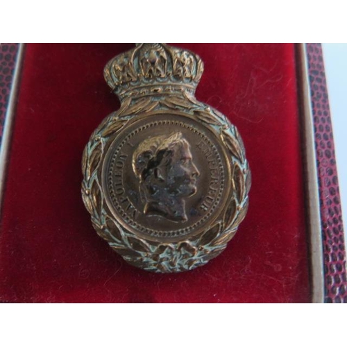 855 - A Napoleon III 1857 medal and ribbon St Helena Medal