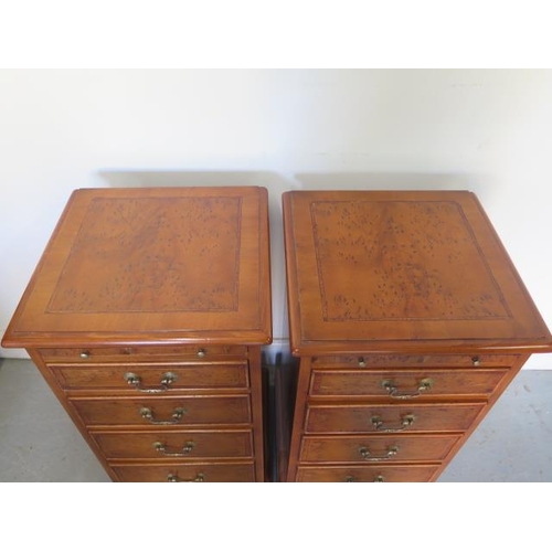 91 - A pair of burr Yew four drawer bedside chests each with a slide made by a local craftsman to a high ... 