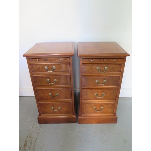 51 - A pair of burr Yew four drawer bedside chests each with a slide made by a local craftsman to a high ... 