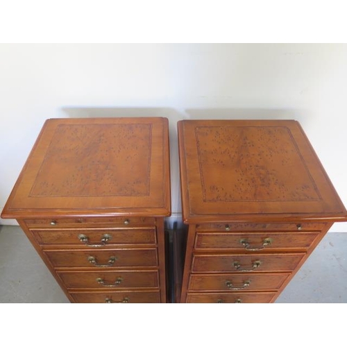 51 - A pair of burr Yew four drawer bedside chests each with a slide made by a local craftsman to a high ... 