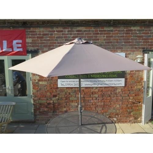 43 - A Four Seasons high quality taupe 250cm tilting parasol, free postage on this item (UK mainland only... 