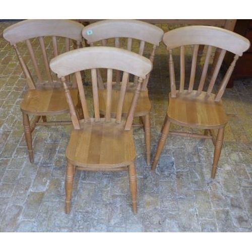 11 - A set of four slat back beech kitchen chairs