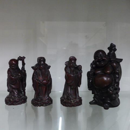 204 - A group of four Oriental style resin figures - Tallest 16cm