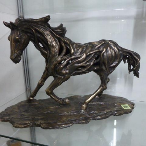 205 - A resin figure of a galloping horse - Height 32cm