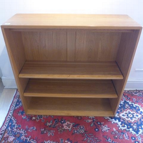 21 - A Ercol floor standing blonde elm bookcase with two adjustable shelves - 92cm x 91cm x 31cm