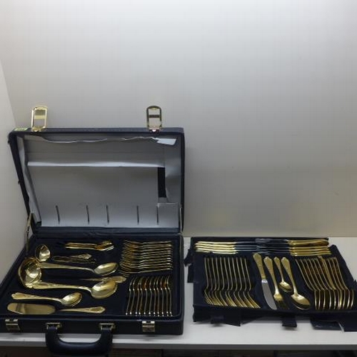 212 - A Bestecke 23/24 Karat gold plated 12 setting canteen/briefcase of cutlery