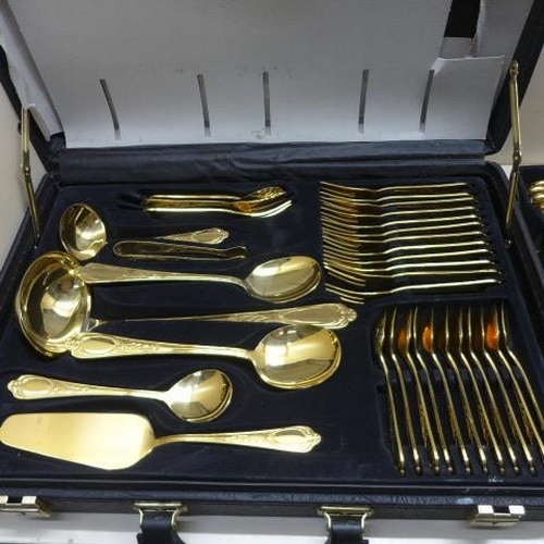 212 - A Bestecke 23/24 Karat gold plated 12 setting canteen/briefcase of cutlery