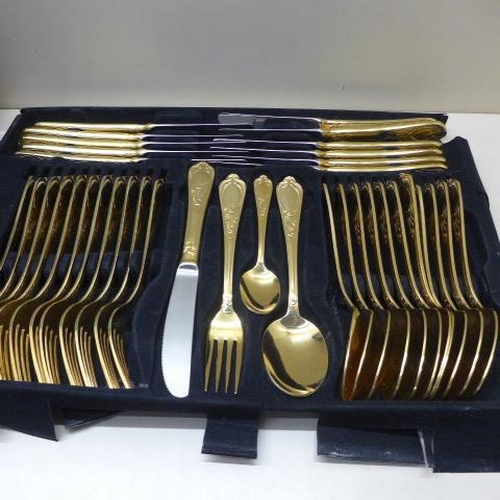 212 - A Bestecke 23/24 Karat gold plated 12 setting canteen/briefcase of cutlery