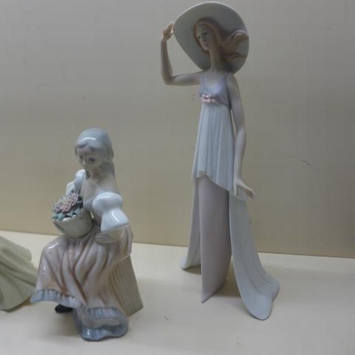 214 - A Lladro lady in a bonnet - Height 35cm, matt finish, a Lladro Society plaque - both good, a Lladro ... 