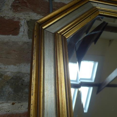 26 - A gilt framed wall mirror - 90cm x 116cm