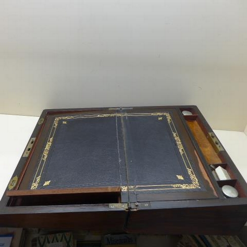 31 - A 19th century rosewood brass bound writing slope with two secret drawers - needs some restoration t... 
