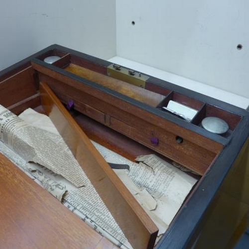 31 - A 19th century rosewood brass bound writing slope with two secret drawers - needs some restoration t... 