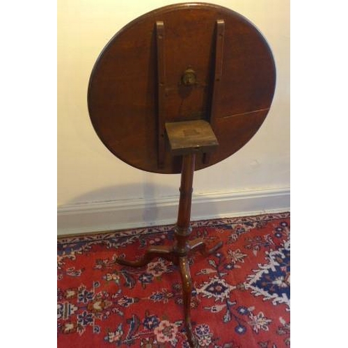 35 - A 19th century mahogany tilt top side table on a turned colomn and tripod base - Height 74cm x Diame... 