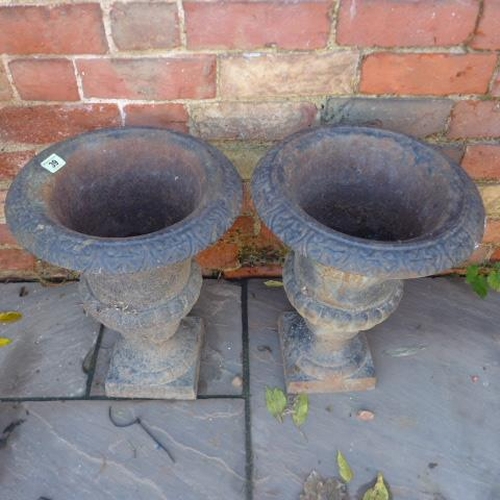 39 - A pair of cast iron garden urns - Height 45cm