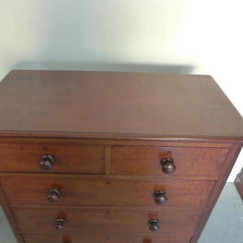 67 - A Victorian mahogany and cedar lined chest of two over three drawers with bun handles - Height 105cm... 