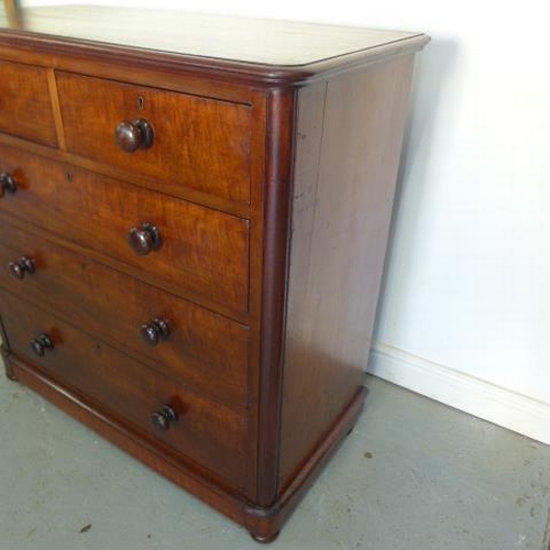 67 - A Victorian mahogany and cedar lined chest of two over three drawers with bun handles - Height 105cm... 