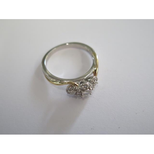 422 - A 10ct white and yellow gold diamond halo cluster ring, diamonds bright and lively, size N, approx 3... 