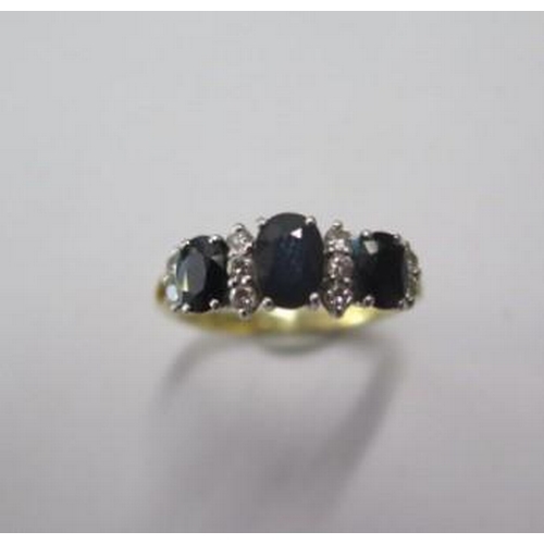 423 - A hallmarked 18ct yellow gold sapphire and diamond ring, size N, approx 3.4 grams, in good condition