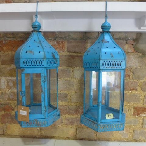 32 - A pair of antique style Arabian metal and glass hanging lanterns - Height 57cm