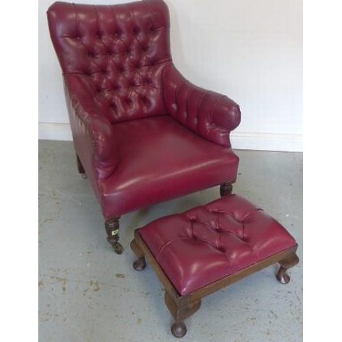 65 - A late Victorian armchair reupholstered in maroon button faux leather with a footstool - Height of c... 