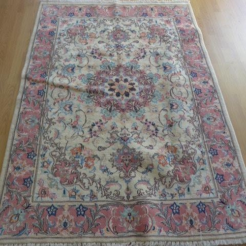 136 - A hand knotted woollen handmade Tabriz rug - 1.94m x 1.40m