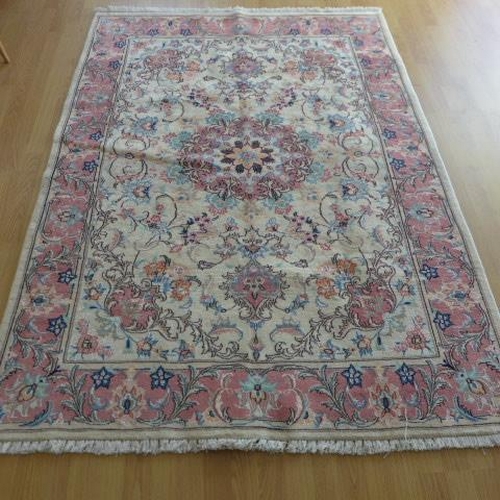 136 - A hand knotted woollen handmade Tabriz rug - 1.94m x 1.40m