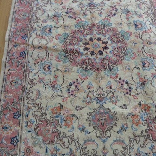 136 - A hand knotted woollen handmade Tabriz rug - 1.94m x 1.40m