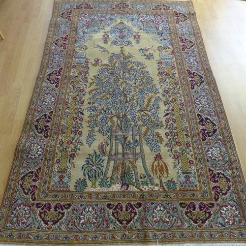 135 - A hand knotted woollen fine Qom, silk inlaid rug - 2.22m x 1.34m