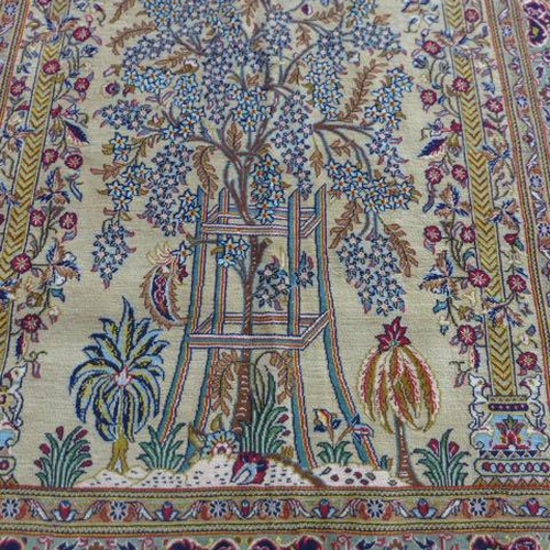 135 - A hand knotted woollen fine Qom, silk inlaid rug - 2.22m x 1.34m