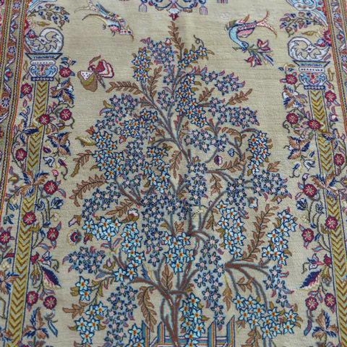 135 - A hand knotted woollen fine Qom, silk inlaid rug - 2.22m x 1.34m