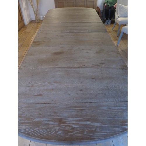 1 - An OKA style limed oak dining table with four leaves on turned legs - measures 11ft x 47 inches wide... 