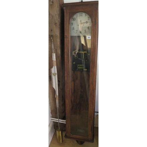 102 - An oak case electric master clock - Height 137cm