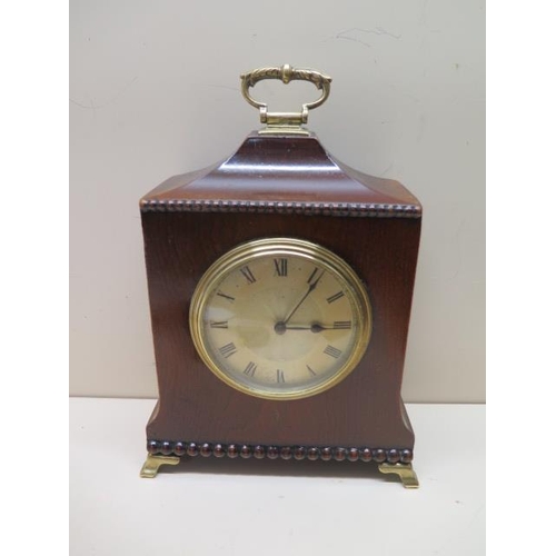 105 - An 8 day mahogany cased mantle clock with brass handle and feet - Height 24cm - running