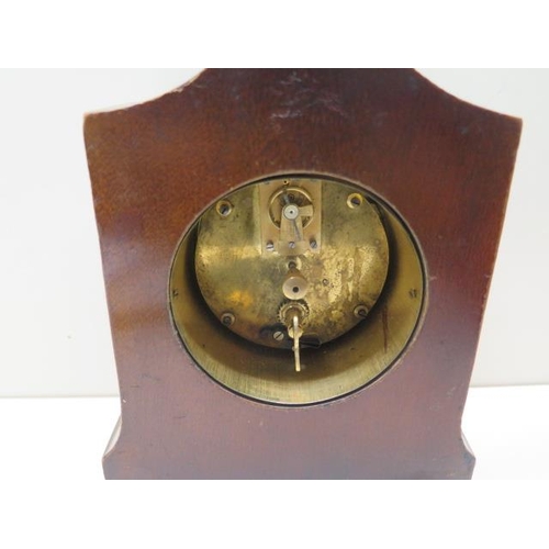 105 - An 8 day mahogany cased mantle clock with brass handle and feet - Height 24cm - running