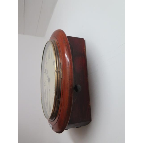 107 - A 12 inch dial wall clock with 8 day spring movement - in running order