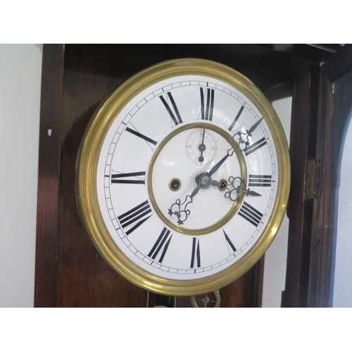 108 - A walnut double weight Vienna wall clock movement 391 striking on a gong - Hight 117cm