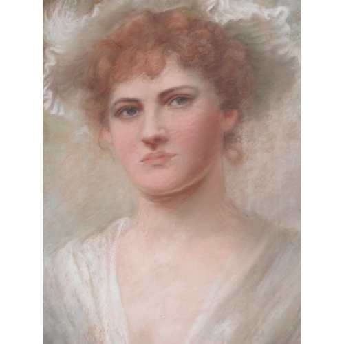 163 - A pastel portrait of a young lady in a gilt frame, signed indistinctly - frame size 74cm x 55cm