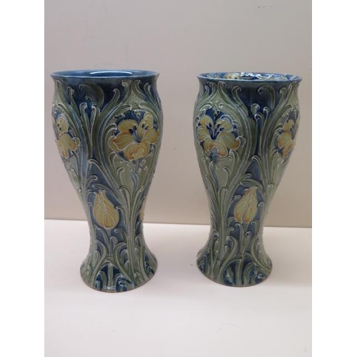 203 - William Moorcroft green signature near pair of Florian type vases - Height 25cm - one has a chip to ... 