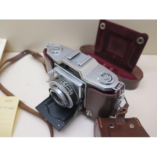 205 - Zeiss Ikon Compur - Rapid shutter 35 Ikonta camera with attachments etc and original receipt dated 1... 