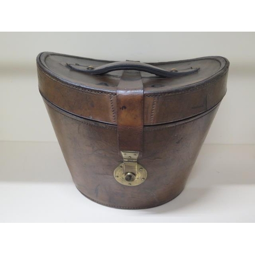 206 - A Victorian leather top hat box in polished condition, brass lock operates by pushing lock pin downw... 