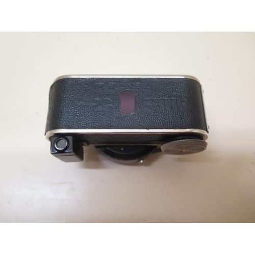 208 - A Minifex miniature spy camera for 16mm rollfilm, 13mm x 18mm fitted with a Vidar lens F:25MM F/3.5-... 