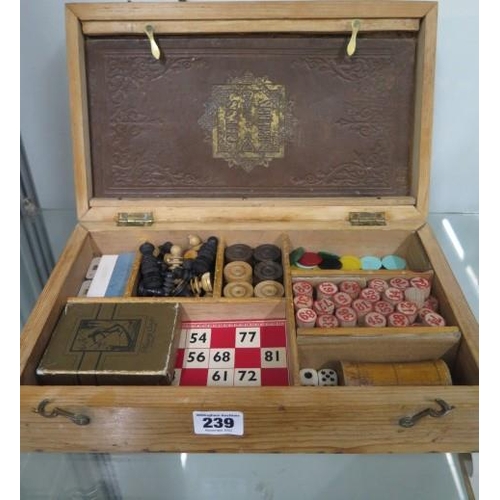 239 - An early 1900's/Edwardian games compendium in fitted pine case includes chess, draughts, dice, bingo... 