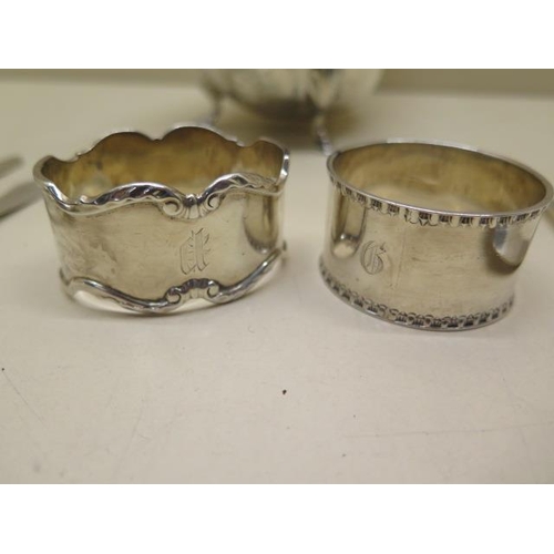 326 - A silver sauce boat, two silver napkin rings and four silver spoons and a knife - total approx weigh... 