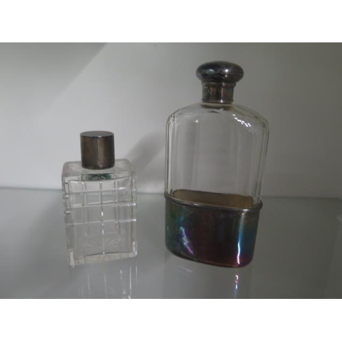 327 - A hip flask with silver cup and top and a silver top bottle - cup approx 1.7 troy oz