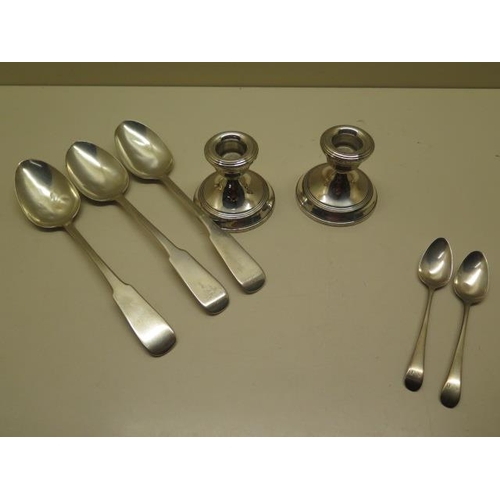 329 - Three silver table spoons, two silver teaspoons and a pair of silver weighted candlesticks - total w... 