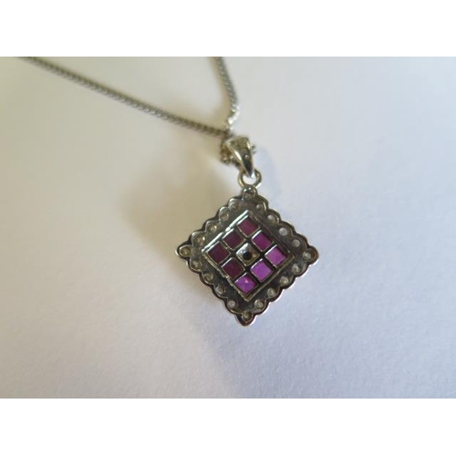 426 - An 18ct white gold ruby and diamond set pendant 12mm square on 47cm white gold chain - total approx ... 