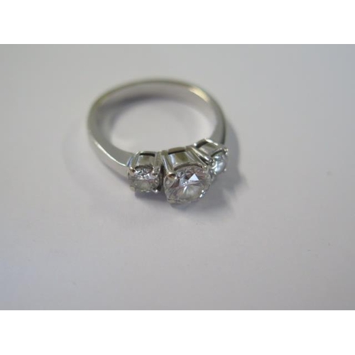 427 - A good 18ct 750 white gold three stone diamond ring with a central 1.04ct diamond flanked by two sma... 