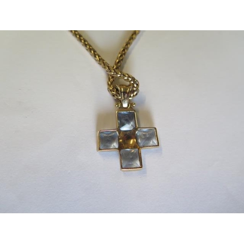 433 - A 9ct yellow gold blue stone cross on a 9ct yellow gold 46cm chain - total weight approx 14.3 grams